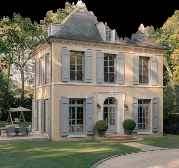 Pale stone villa with grey shutters on a lawn
